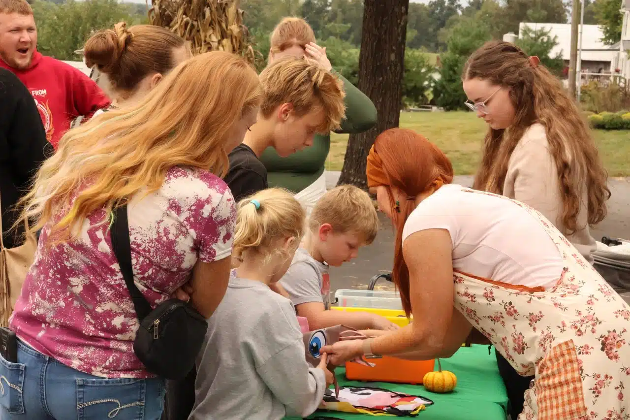 A group of patrons gathers to visit the bookmobile. 